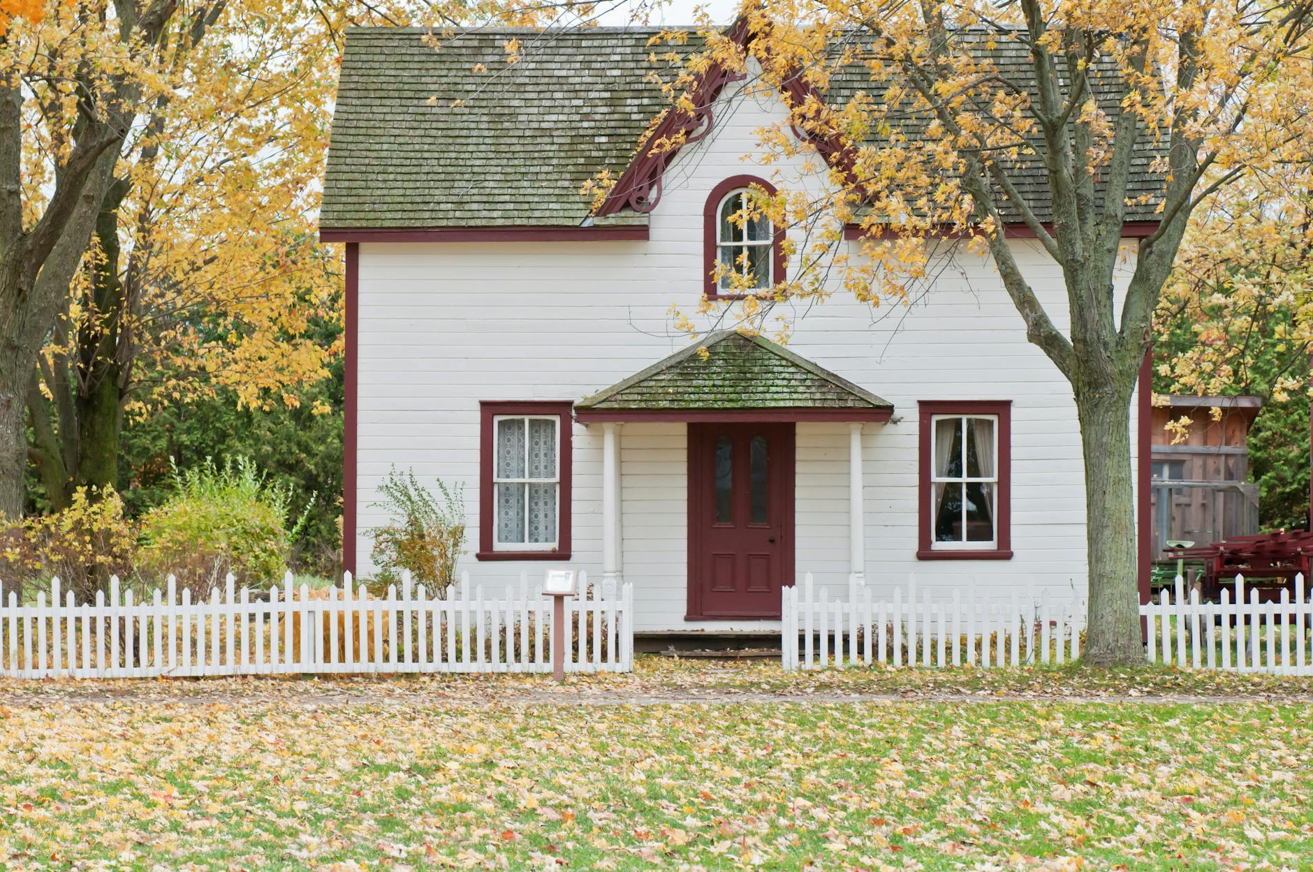 pexels-photo-1029599 white and red wooden house with fence